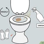Illustration showing cleaning instructions for a bidet nozzle with vinegar and gloves.