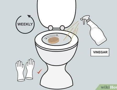 Illustration showing cleaning instructions for a bidet nozzle with vinegar and gloves.