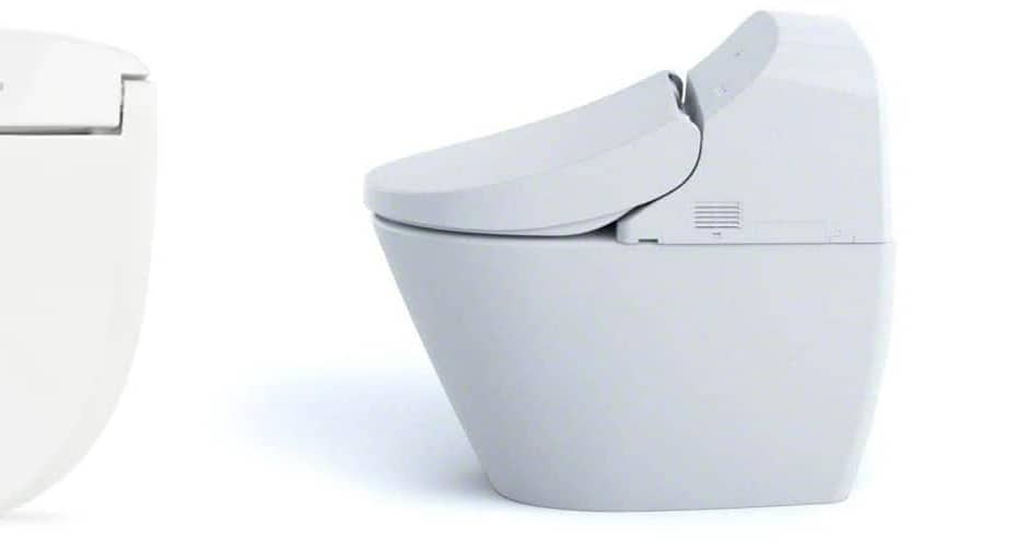 White bidet toilet attachment with remote control on the side and a modern toilet design.