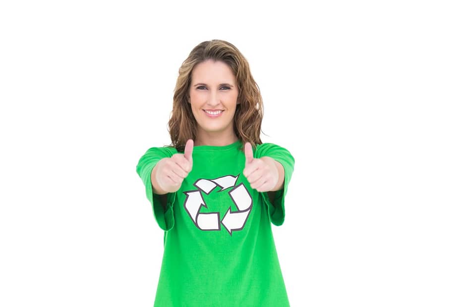 Woman wearing a green t-shirt with a recycling symbol, giving a thumbs up.